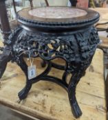 A 19th century Chinese carved hardwood jardiniere stand, with a rouge marble inset top, diameter