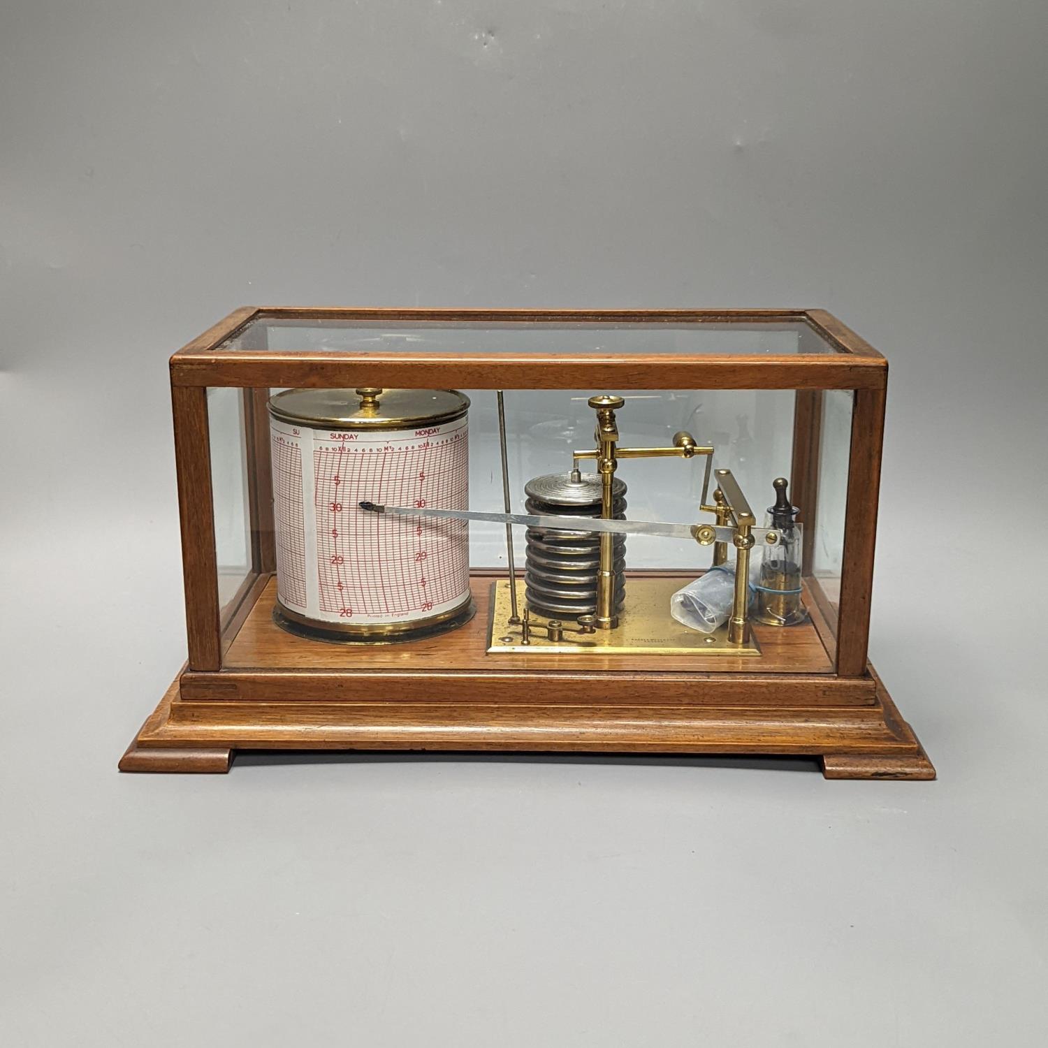 A Short & Mason oak cased barograph with spare graph paper