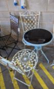 A circular glass top bistro table, diameter 50cm, height 72cm together with two painted metal