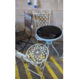 A circular glass top bistro table, diameter 50cm, height 72cm together with two painted metal