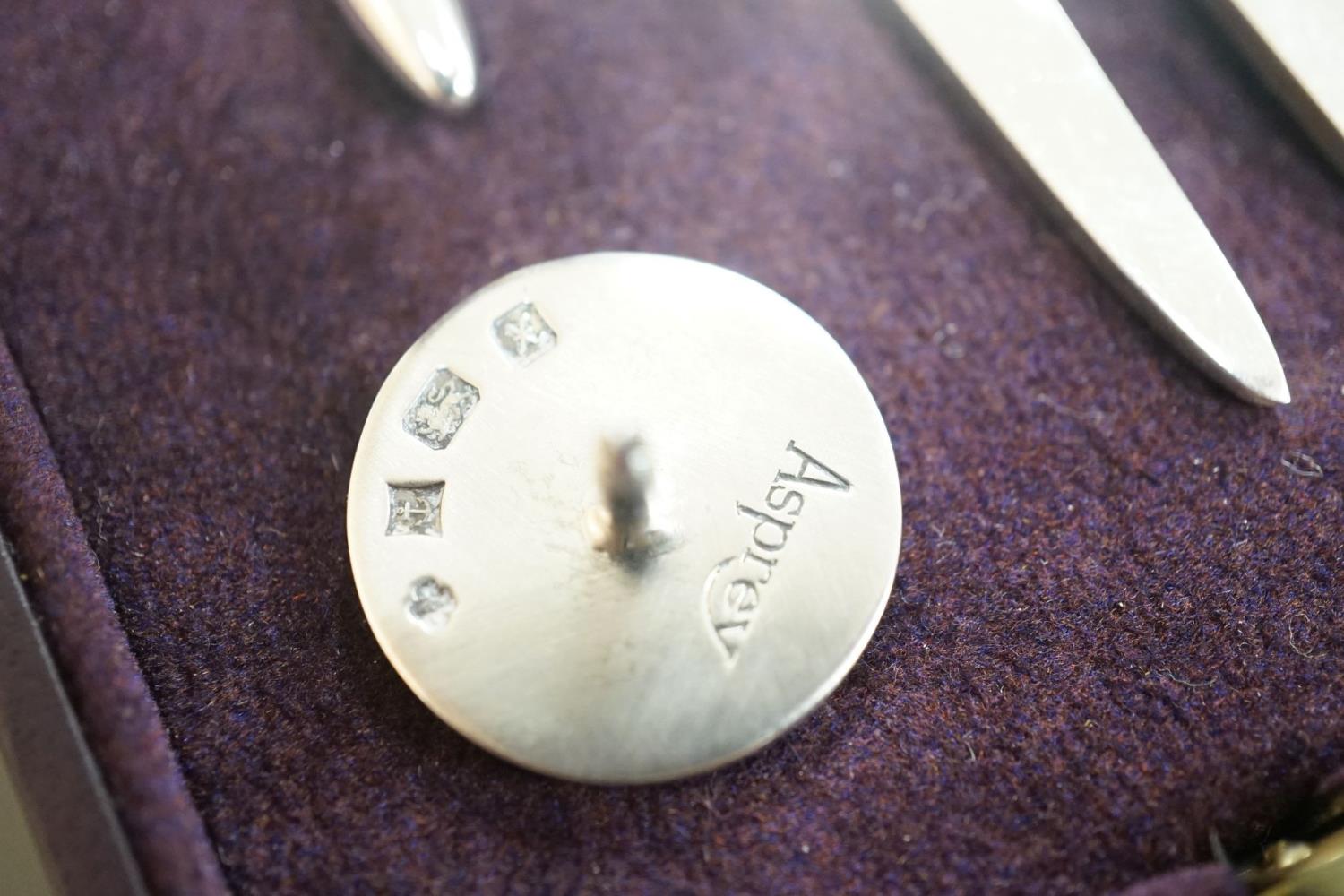 A modern Asprey cased silver golfer's companion set, comprising a tee, marker and pitch mark - Image 7 of 7