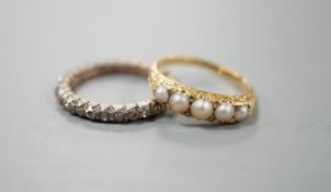 A 19th century yellow metal and rose diamond set full eternity ring, size L/M and an early 20th