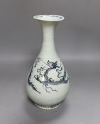 A Chinese blue and white ‘dragon’ bottle vase 25cm