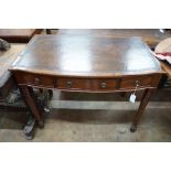 A Regency style mahogany bow front three drawer writing table, width 101cm, depth 61cm, height 76cm