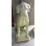 A reconstituted stone seated hound garden ornament, height 72cm