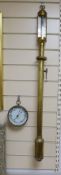 A marine stick barometer and an aneroid barometer,stick barometer 90 cms high.