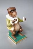 A Derby rare figure from a bear band, c.1820, wearing a green, gold and yellow jacket playing the