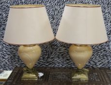 A pair of marbled ceramic and brass designer table lamps,,61 cms including shades.