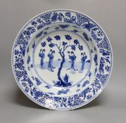 A Chinese blue and white ‘ladies’ basin, Kangxi period, cracked 34cm