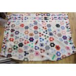 A patchwork quilt, made from Edwardian and later fabrics,232 cms x 252cms.