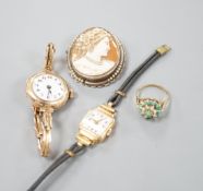 A lady's early 20th century 9ct gold manual wind wrist watch, on a 9ct strap, gross 16.4 grams, a