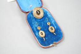 A cased Victorian yellow metal, black enamel and seed pearl set brooch, 35mm and matching pair of