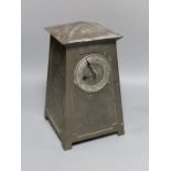 An Art Nouveau Liberty style hammered pewter mantel timepiece, Lenzkirch movement with key, 28 cms