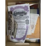 Assorted ephemera, stamps, postcard portraits of royalty, books of political cartoons, share