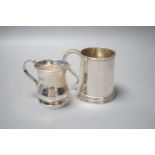 A George V silver christening mug, Goldsmiths & Silversmiths Co. Ltd, London, 1915, 85mm and a