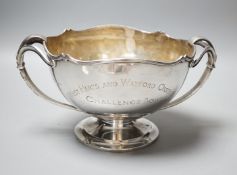 A George V silver two handled presentation pedestal bowl, with engraved inscription, Adie Bros.