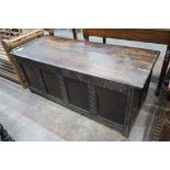 An 18th century and later carved panelled oak coffer, width 145cm, depth 58cm, height 61cm