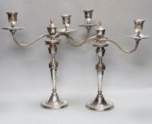 A pair of Sheffield plate two branch two light candelabrum,37 cms high.