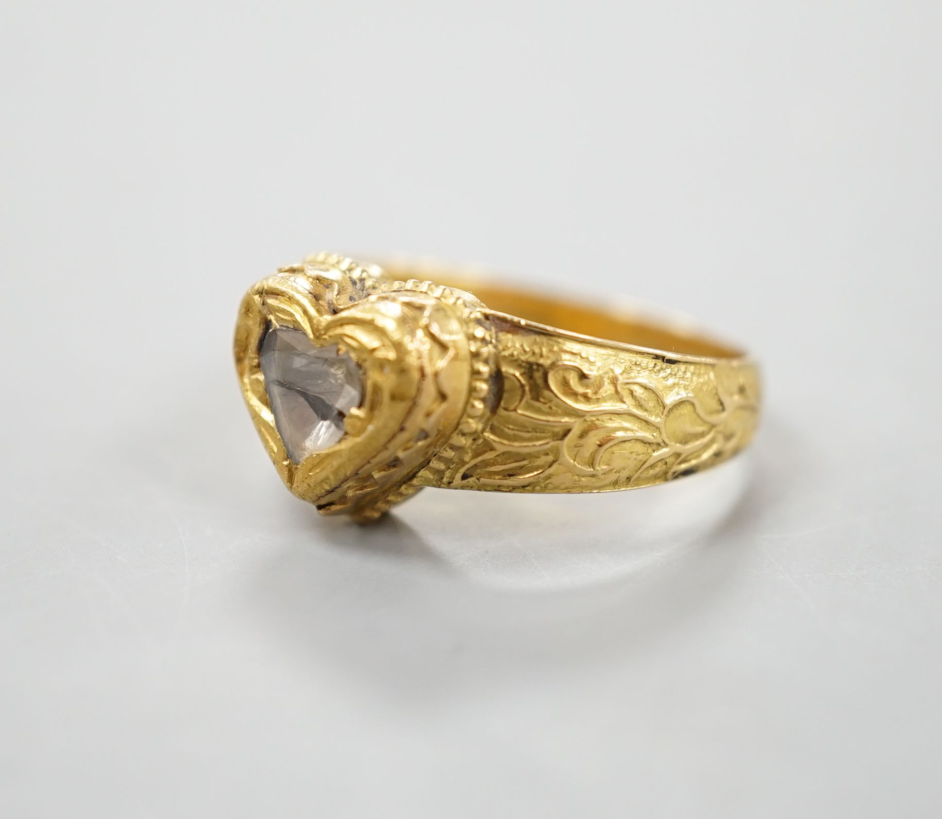 An Indian yellow metal and heart shaped diamond set ring, with engraved shank, size O, gross - Image 8 of 10