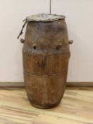 A 19th/20th century Ashanti breasted drum,61 cms high.