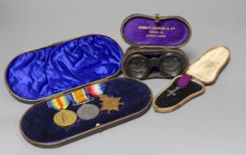 A WWI trio to J L Muir, Royal Fusiliers, a miniature medal, and a pair of opera glasses