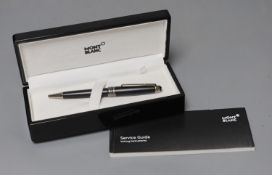 A Mont Blanc retractable ball point pen with original case, cardboard sleeve and service