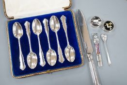 A cased set of six silver teaspoons, a silver bread knife, two 925 pill boxes, an 800 and enamel '