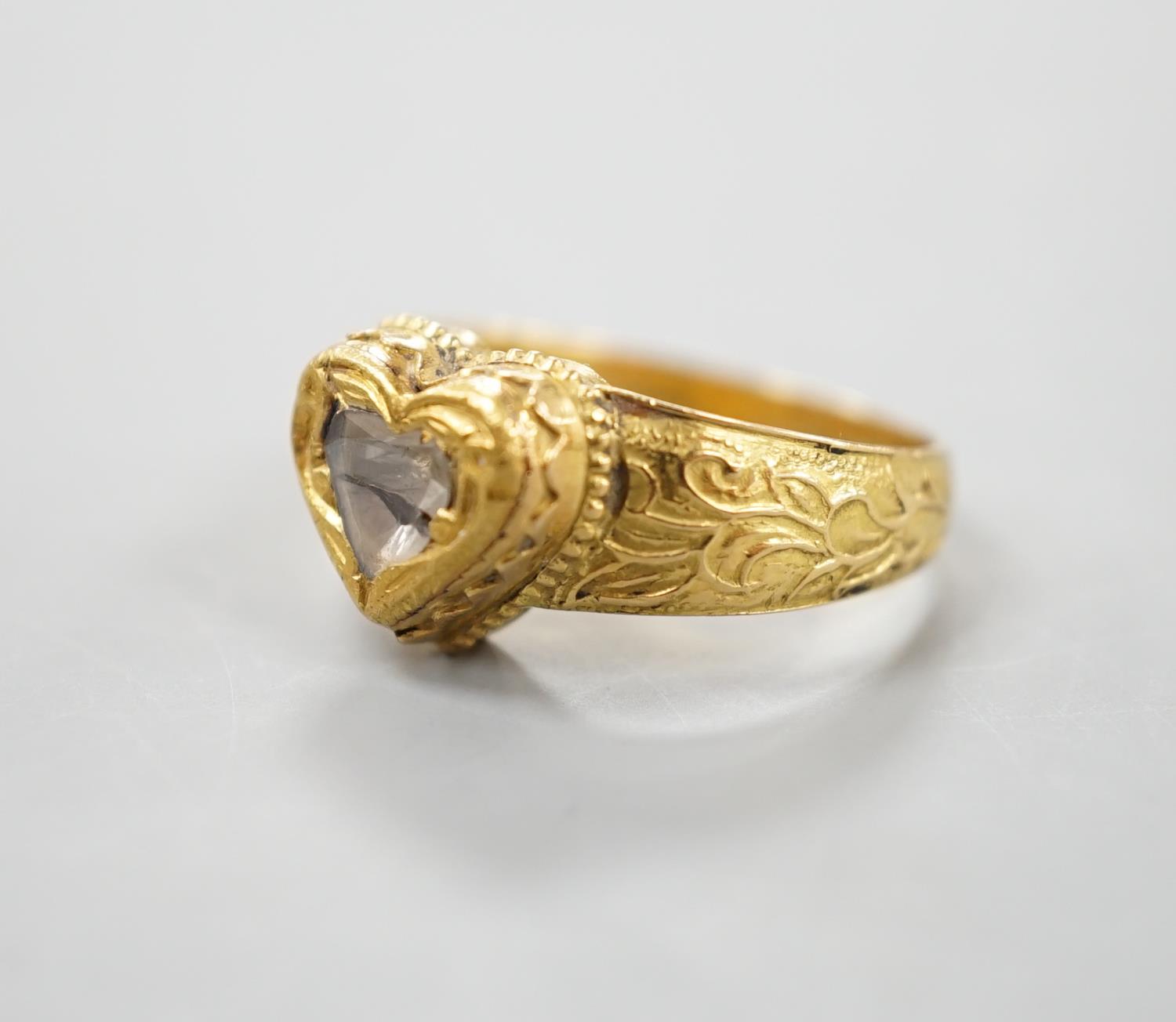 An Indian yellow metal and heart shaped diamond set ring, with engraved shank, size O, gross - Image 4 of 10