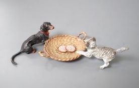A cold painted bronze group of a Dachshund and a kitten 10cm