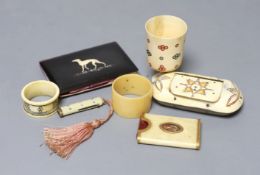 A George III ivory needle case, 6cm. a Victorian card purse inlaid with a whippet, 9.5cm, a horn