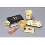 A George III ivory needle case, 6cm. a Victorian card purse inlaid with a whippet, 9.5cm, a horn