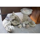 Two reconstituted stone garden bird baths, one moulded with squirrel and five stone garden animal