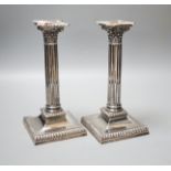 A pair of late Victorian silver Corinthian column candlesticks, Hawksworth, Eyre & Co, Sheffield,