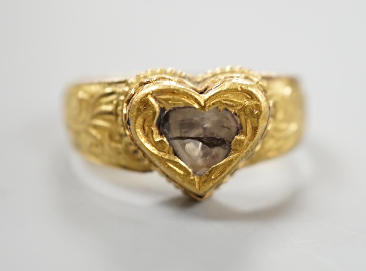 An Indian yellow metal and heart shaped diamond set ring, with engraved shank, size O, gross - Image 3 of 10