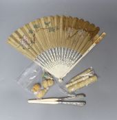 A mix collection of antique ivory to include needle cases, silver mounted gloves stretcher, etc