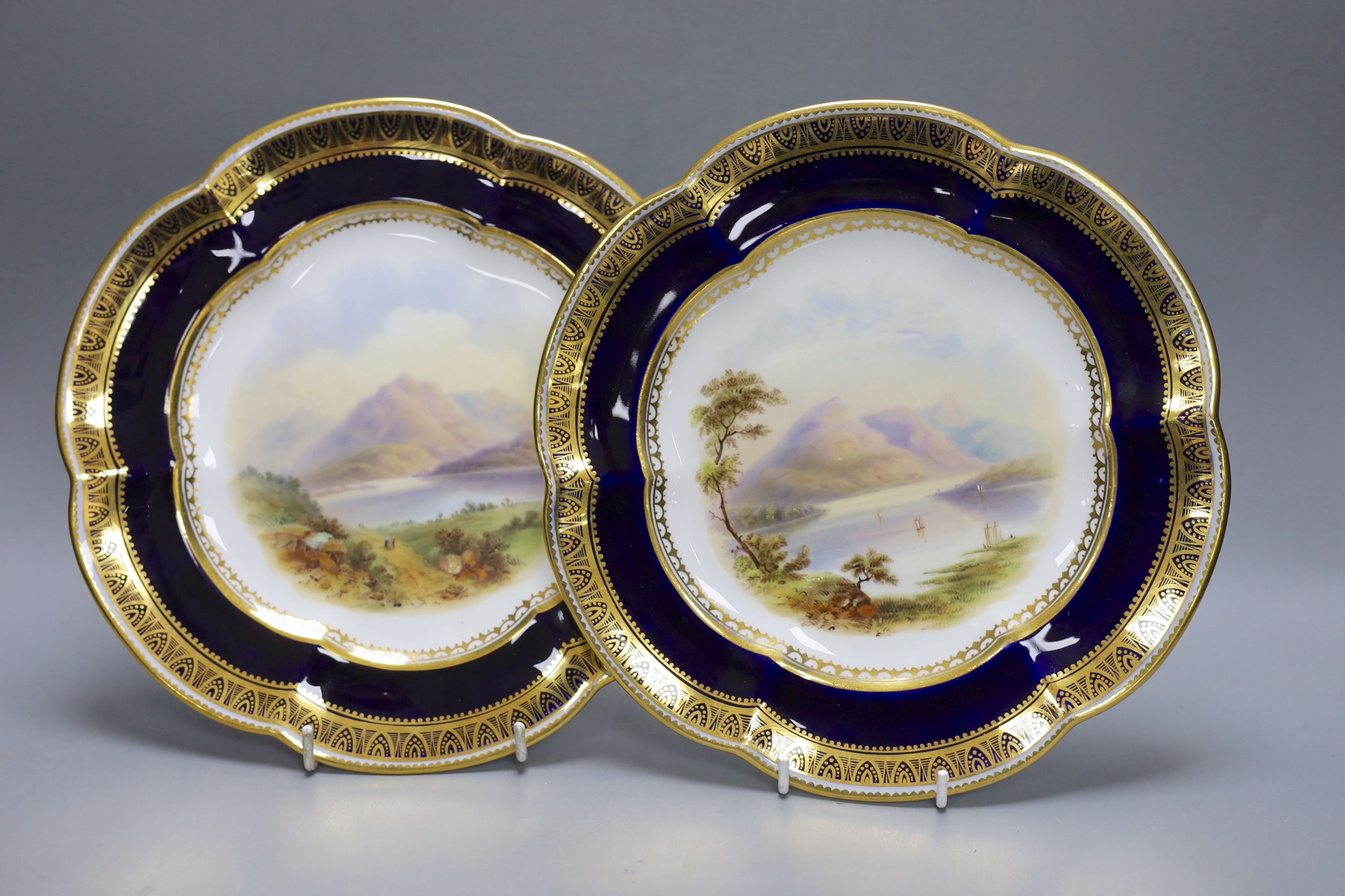 A pair of Coalport plates painted with Scottish loch scenes, Ben Lomond and Loch Ard c. 1850 cf.