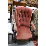 A single Victorian carved rosewood scroll back upholstered open armchair