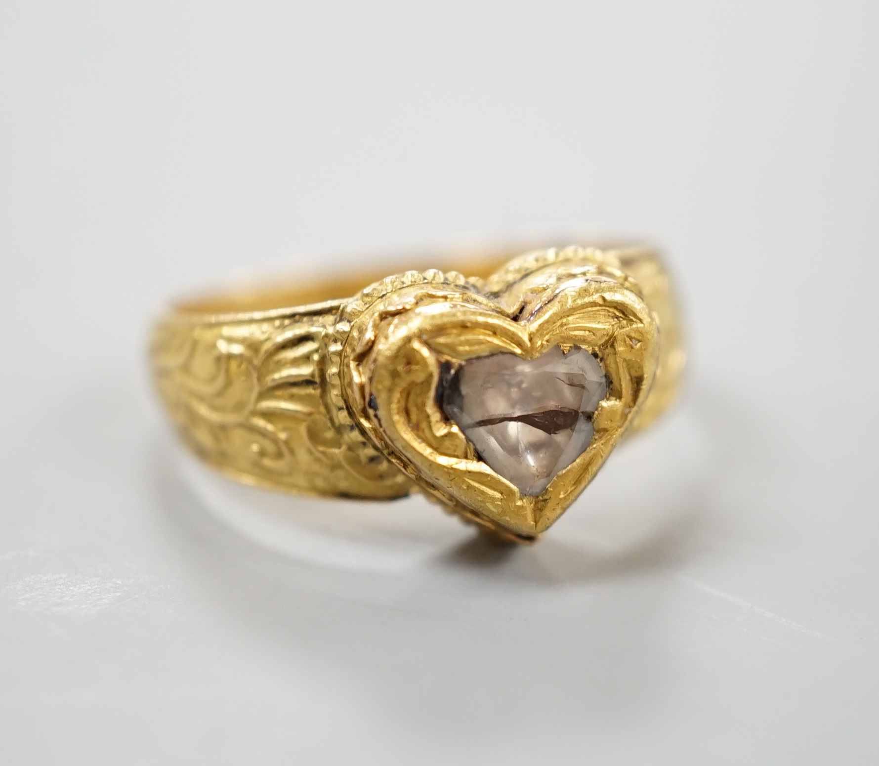 An Indian yellow metal and heart shaped diamond set ring, with engraved shank, size O, gross - Image 2 of 10