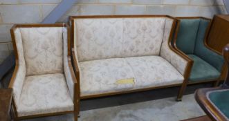 An Edwardian inlaid mahogany three piece salon suite, settee length 143cm, depth 70cm, height 104cm