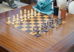 A reproduction square mahogany inlaid games table with chequer board surface, interior with baize