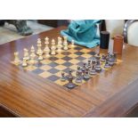 A reproduction square mahogany inlaid games table with chequer board surface, interior with baize