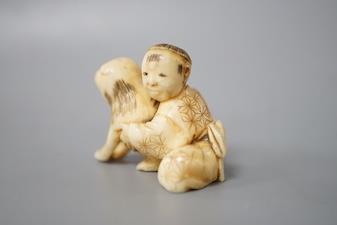 A Japanese ivory netsuke of a boy and puppy, Meiji period, unsigned, 4cm - Image 2 of 5