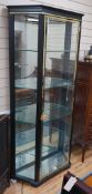 A brass mounted black painted display cabinet with interior lighting, width 92cm, depth 34cm, height