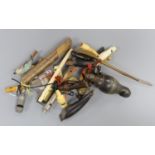 A collection of various collectable 19th century whistles, including bone, pewter, horn, ebony,