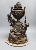 An early 20th century French bronzed spelter cherubic mantel clock 52cm