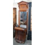 A George IV mahogany pier glass and table with arched pediment width 66 cms total height 252 cms.