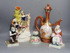 A Victorian Staffordshire flatback group, a pair of Staffordshire figures, an inkwell and a Japanese