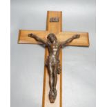 A bronze Corpus Christi, mounted on a wooden cross,Height of cross, 60.5 cms.