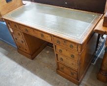 A Victorian light oak pedestal desk, fitted nine small drawers, width 120cm, depth 59cm, height