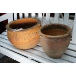 Two circular terracotta garden planters, larger width 38cm, height 23cm